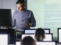 Professor teaching from computer