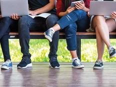 A group of college students seated on a bench