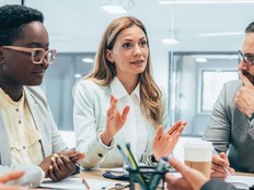 A group of people chat together