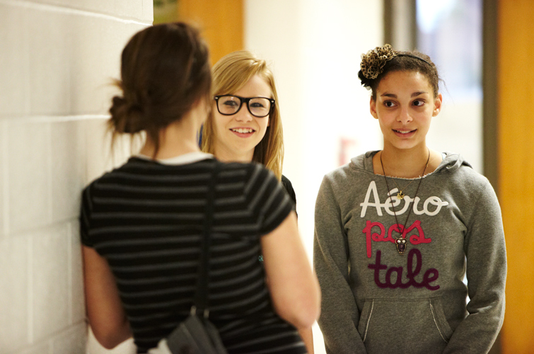 Courtney Putnam (center) and Erika Felix interview a fellow student for “The Erika Show,” a segment in the FIN program’s biweekly video broadcast.