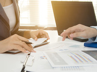 School administrators working on an audit at a desk