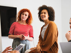 Colleagues gathering in boardroom